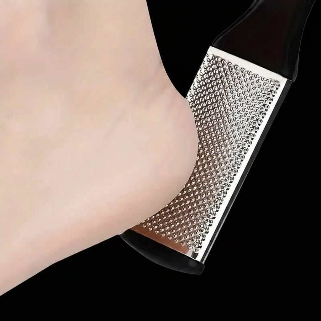 Black high-heeled shoe with rhinestone embellishments on a white background