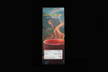 Aether Lux Coffee package with a cup of steaming coffee on a white background