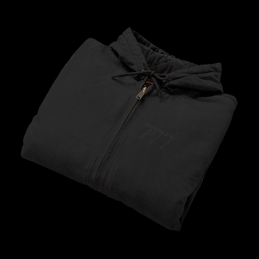 Folded black jacket with a logo on a white background