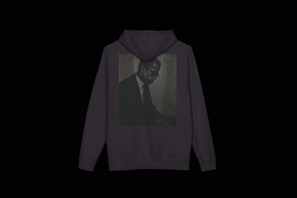 Black hoodie with a printed design on the back featuring a person in a suit.