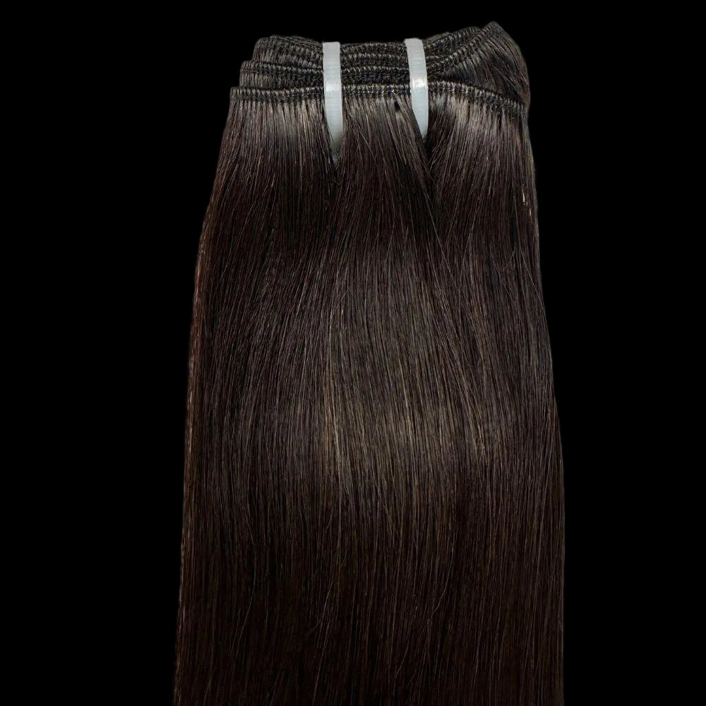 Dark brown hair extensions on a white background