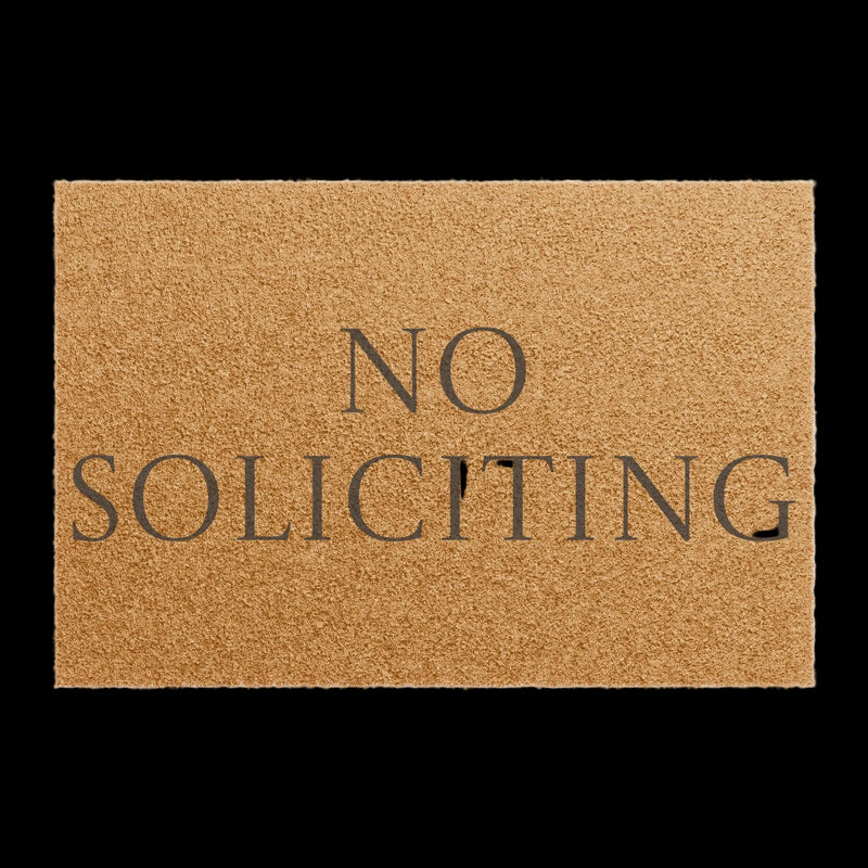 Doormat with 'No Soliciting' text on a beige background