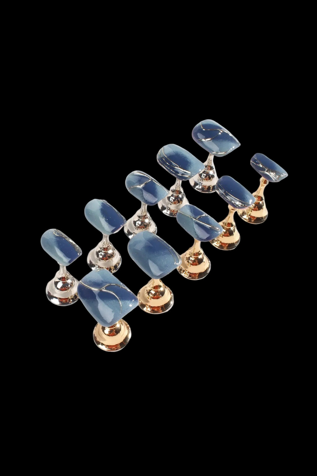 Pair of blue and gold earrings on a white background