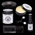 Collection of Buck Yeah beard care products including cream, oil, comb, and scissors on a white background.