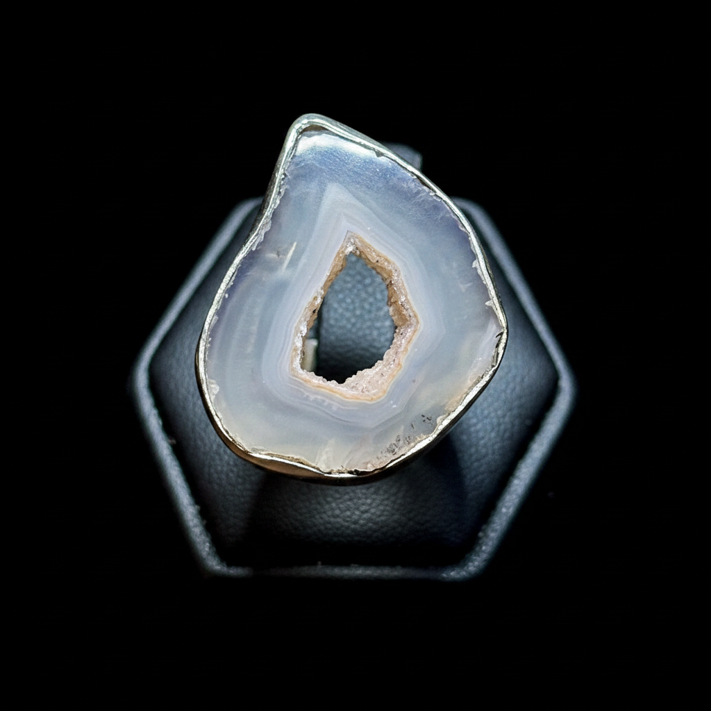Geode crystal in a jewelry display box with a black background