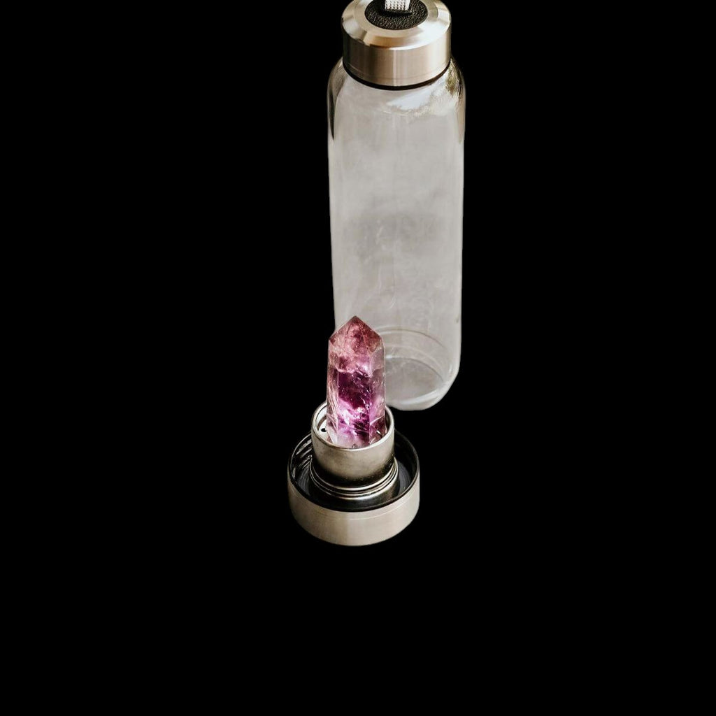 AetherLux™️ glass water bottle with a faceted amethyst crystal in the cap. Purple crystal for healing.