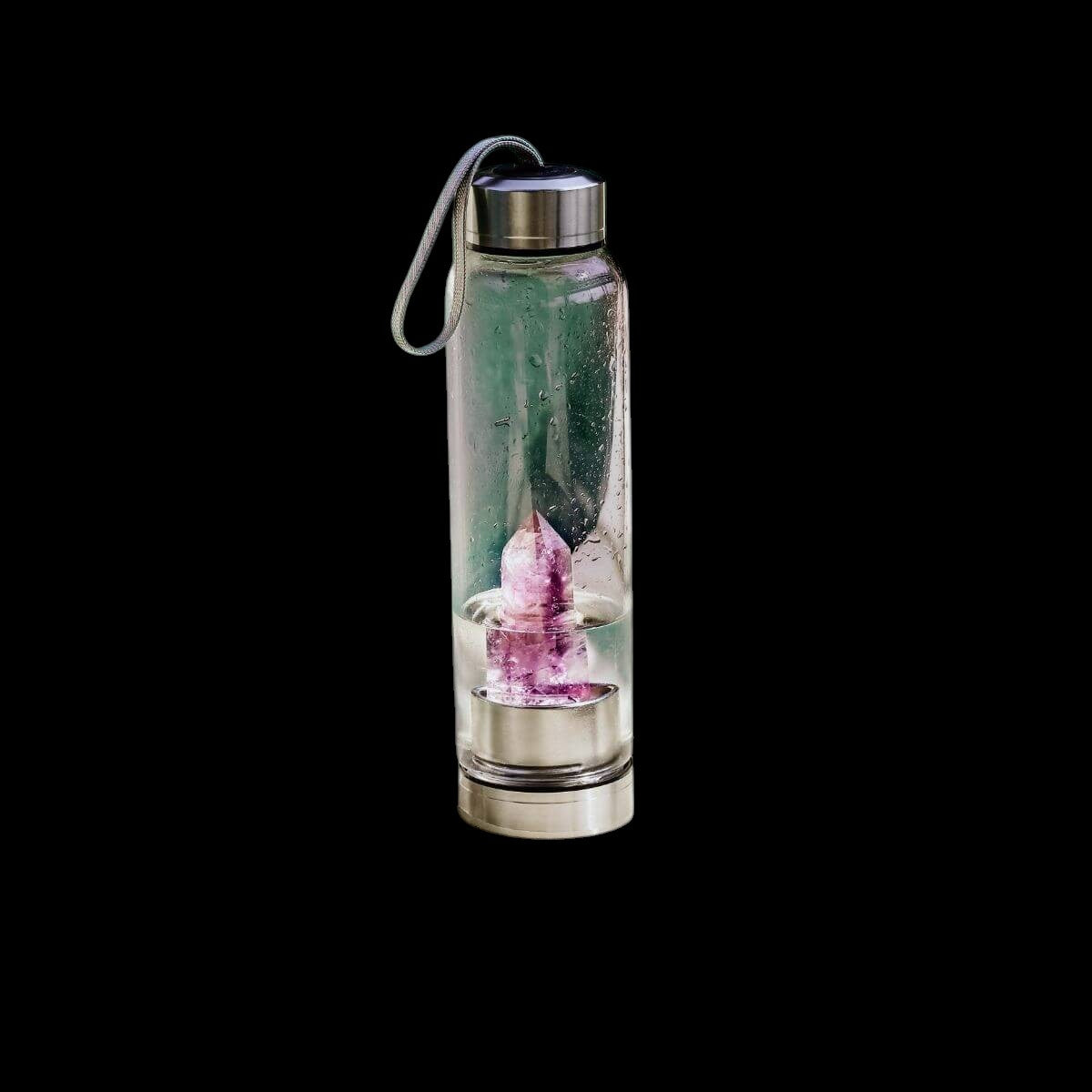 AetherLux™️ glass water bottle with a pink amethyst crystal inside, on a black background.