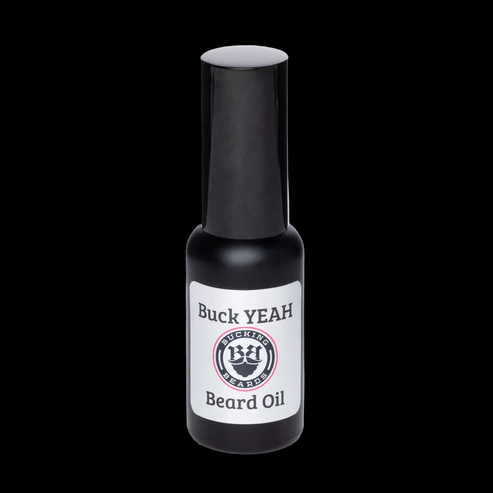 Black bottle of Buck YEAH beard oil on a white background