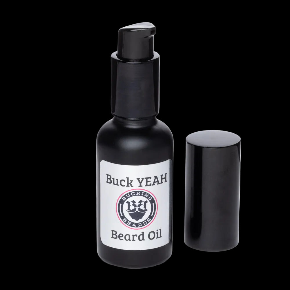 Black beard oil bottle with pump labeled 'Buck YEAH' on a white background