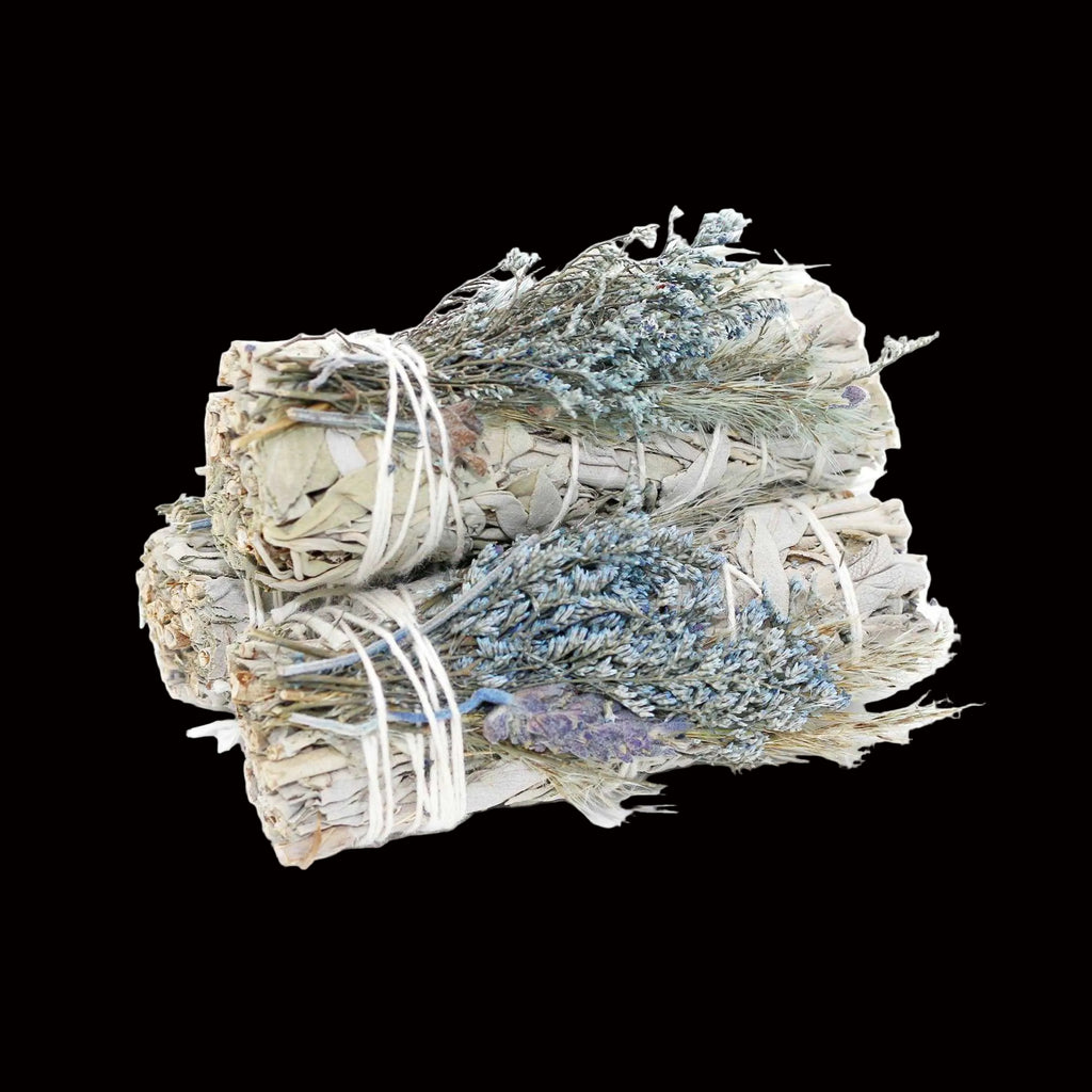 Three bundles of sage and lavender tied together on a white background