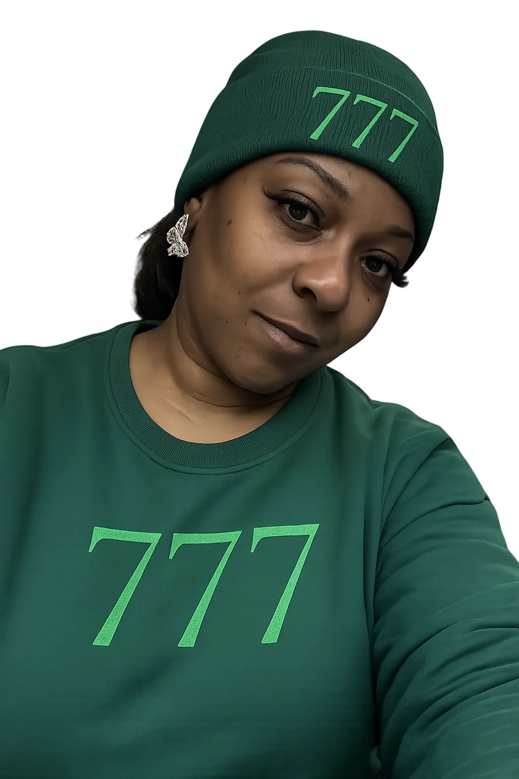 Person wearing a green beanie and shirt with '777' print on a white background