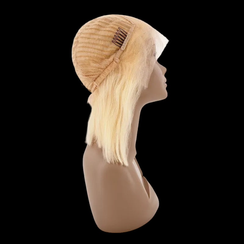 Blonde wig on a mannequin head with a white background