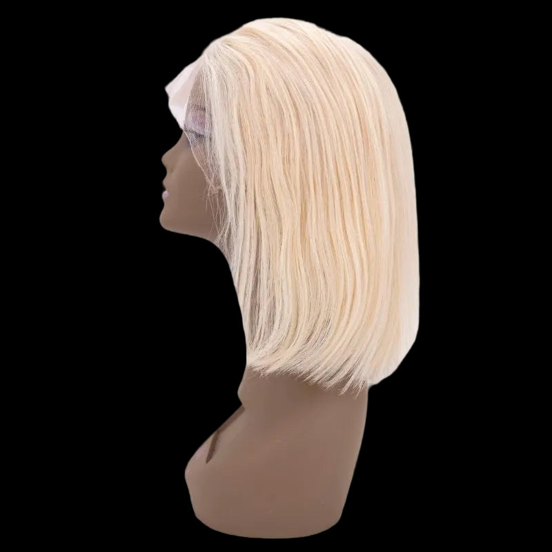 Blonde wig on a mannequin head against a white background
