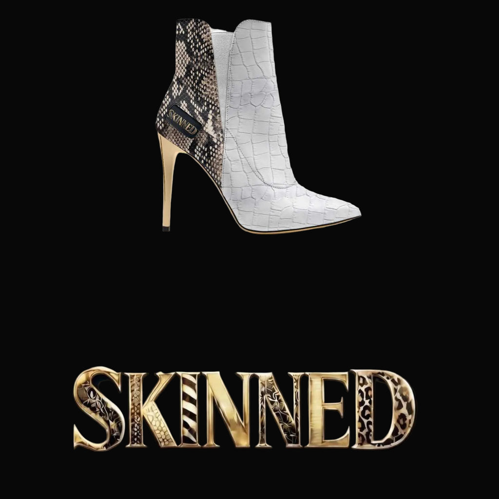 Two high-heeled boots on a black box with 'SKINNED' branding.