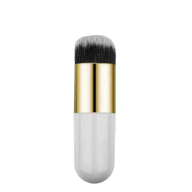 Makeup brush with gold and white handle on a white background
